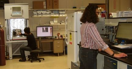 Two researchers working in the CLSF lab.